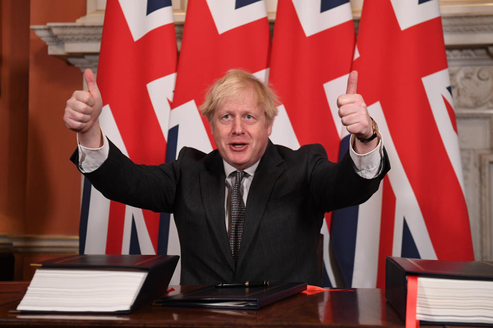 Prime Minister Boris Johnson gives a thumbs up gesture after signing the EU-UK Trade and Cooperation Agreement at 10 Downing Street, Westminster.