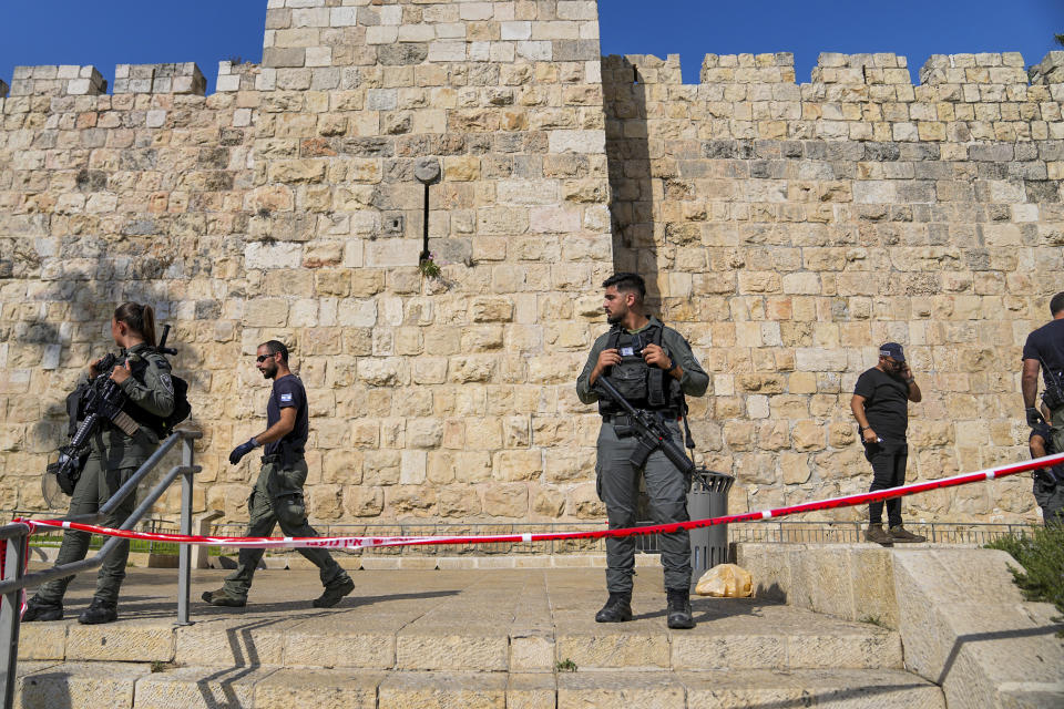 Israeli police inspect the scene of a Palestinian stabbing attack that wounded two people next to Jaffa Gate, just outside Jerusalem's Old City, Wednesday, Sept. 6, 2023. Israeli police said the attacker, 17-year-old Palestinian, was caught and arrested. (AP Photo/Ohad Zwigenberg)