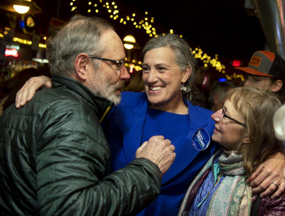 Western Montana U.S. House candidate Monica Tranel, middle, greets supporters at the Union Club in Missoula, Mont., Tuesday, Nov. 8, 2022. Tranel, a Democrat, was running against Republican and former Interior Secretary Ryan Zinke and Libertarian John Lamb. (Ben Allan Smith/The Missoulian via AP)