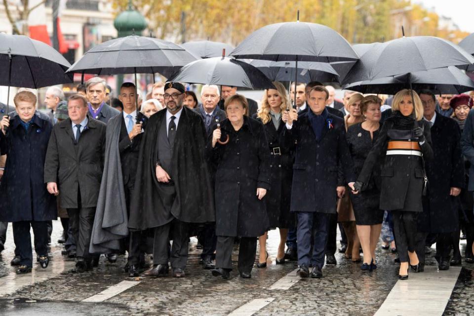 <p>Wearing a chic black coat with brown, white, and black leather panels, black tapered pants, and black pumps, Macron attends a ceremony commemorating the <a rel="nofollow noopener" href="https://www.harpersbazaar.com/celebrity/latest/a24973558/kate-middleton-remembrance-day-centenary-queen-elizabeth/" target="_blank" data-ylk="slk:100th anniversary of the end of World War I;elm:context_link;itc:0;sec:content-canvas" class="link ">100th anniversary of the end of World War I</a>. The Armistice was signed on November 11, 1918, meaning that 2018 marks its centenary.</p>