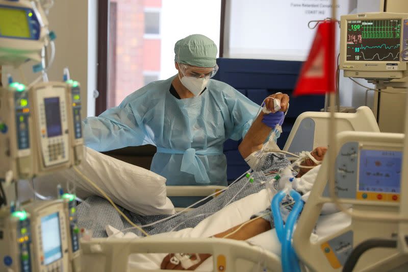 FILE PHOTO: Co-director of the intensive care unit at CommonSpirit's Dignity Health California Hospital Medical Center, Dr. Zafia Anklesaria, attends to a COVID-19 patient