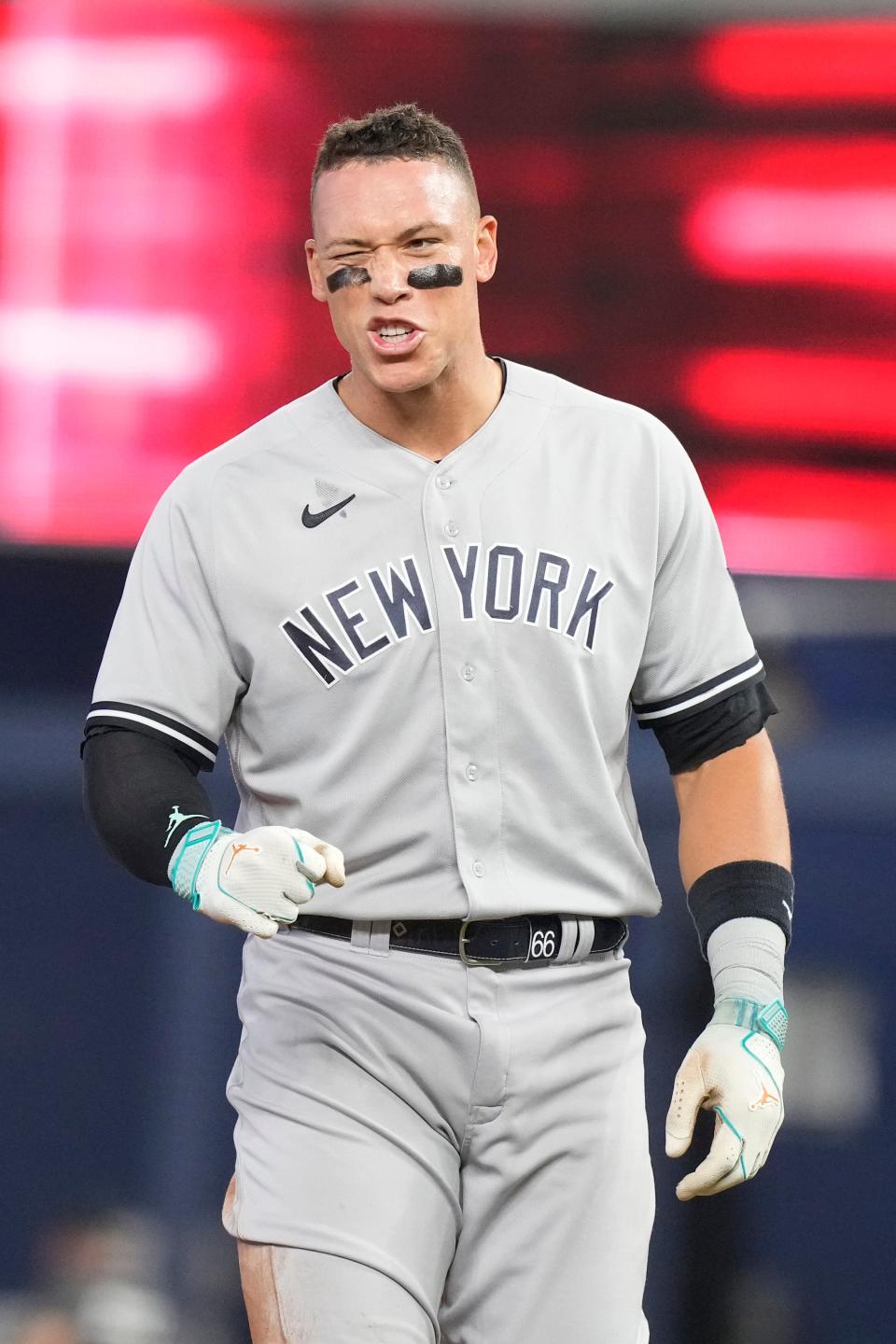New York Yankees' Aaron Judge gestures at a comment by Miami Marlins Jesus Sanchez during the first inning of a baseball game, Saturday, Aug. 12, 2023, in Miami. (AP Photo/Marta Lavandier)