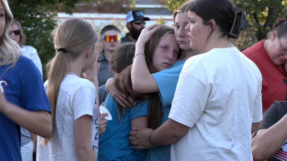Ryan Bilby’s younger sister Brittney held in group embrace by friends
