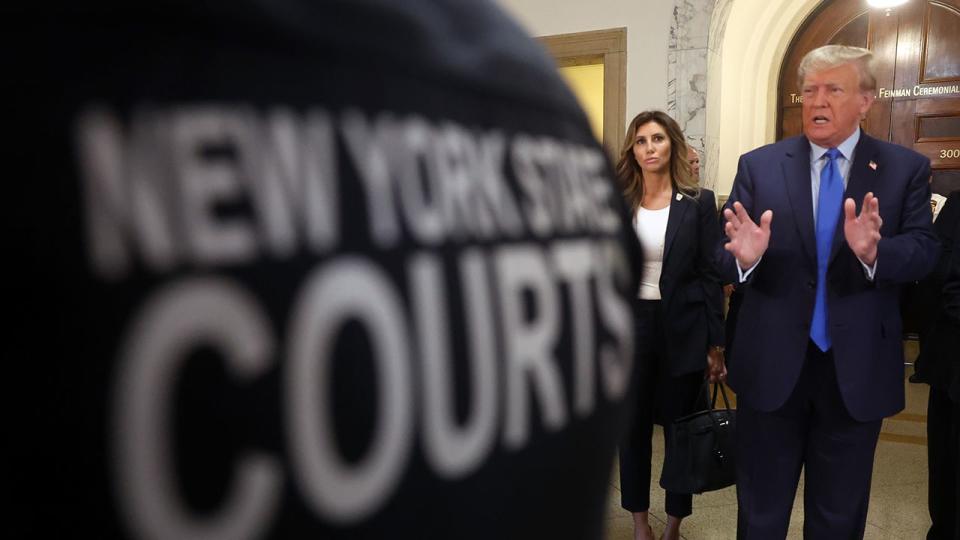 Former President Donald Trump speaks to the media as he arrives at New York State Supreme Court to start the civil fraud trial against him on October 02, 2023 in New York City. Former President Trump may be forced to sell off his properties after Justice Arthur Engoron canceled his business certificates and ruled that he committed fraud for years while building his real estate empire after being sued by Attorney General Letitia James, seeking $250 million in damages. The trial will determine how much he and his companies will be penalized for the fraud.