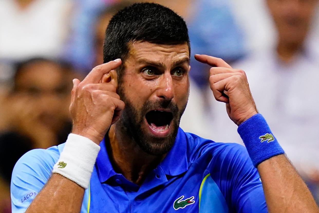 Novak Djokovic, of Serbia, reacts during a break in play against Daniil Medvedev (AP)