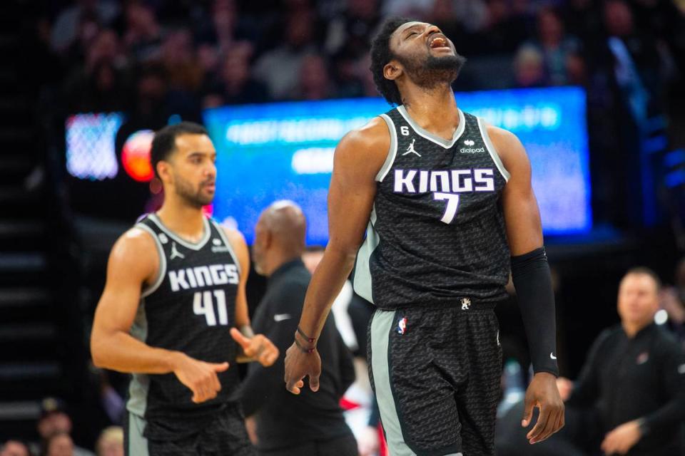 Sacramento Kings forward Chimezie Metu (7) reacts as he walk to the bench during a time out in the fourth quarter during a game at Golden 1 Center in Sacramento, Thursday, Feb. 23, 2023.