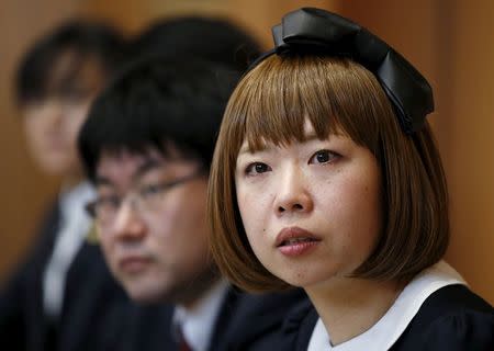 Japanese artist Megumi Igarashi (R), known as Rokudenashiko, attends a news conference with lawyers following a court appearance in Tokyo April 15, 2015. REUTERS/Toru Hanai