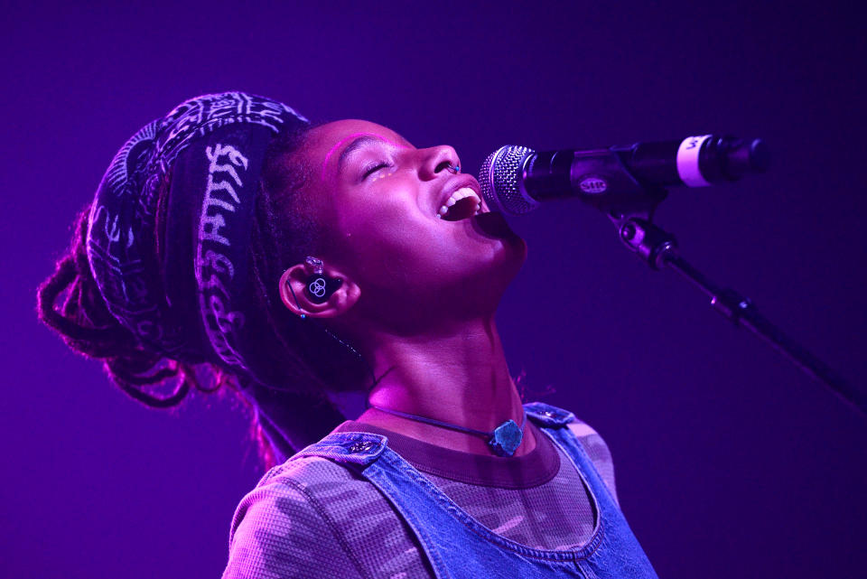 Willow Smith singing into a microphone. (Scott Dudelson / Getty Images)