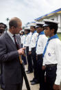 The Duke of Edinburgh talking with a sea cadet when he and Queen Elizabeth II went on a walkabout during a visit to Bridgetown, Barbados, during her Silver Jubilee tour of the Caribbean.