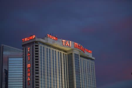 The Trump Taj Mahal Casino is illuminated at dusk in Atlantic City, New Jersey, U.S. October 24, 2014. REUTERS/Mark Makela/File Photo