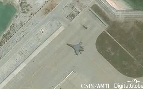 Satellite imagery appears to show a J-11 combat aircraft at China's base on Woody Island in the Paracels - Credit:  REUTERS