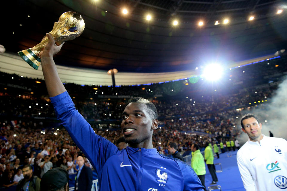 PARIS, FRANCE - SEPTEMBER 09:  Paul Pogba of France celebrate the FIFA World Cup with fan after the UEFA Nations League A group one match between France and Netherlands at Stade de France on September 9, 2018 in Paris, France.  (Photo by Xavier Laine/Getty Images)