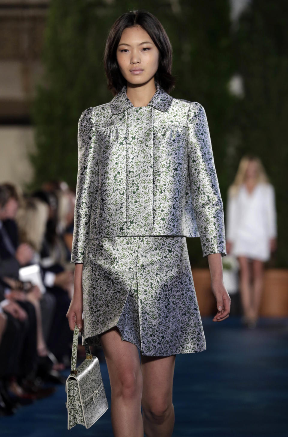 The Tory Burch Spring 2014 collection is modeled during Fashion Week in New York, Tuesday, Sept. 10, 2013. (AP Photo/Richard Drew)