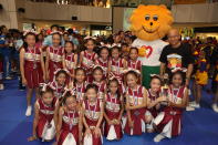 Kranji Primary School's cheerleading squad, Kranji Kougars with Singa and Dr William Wan, General Secretary of the Singapore Kindness Movement.