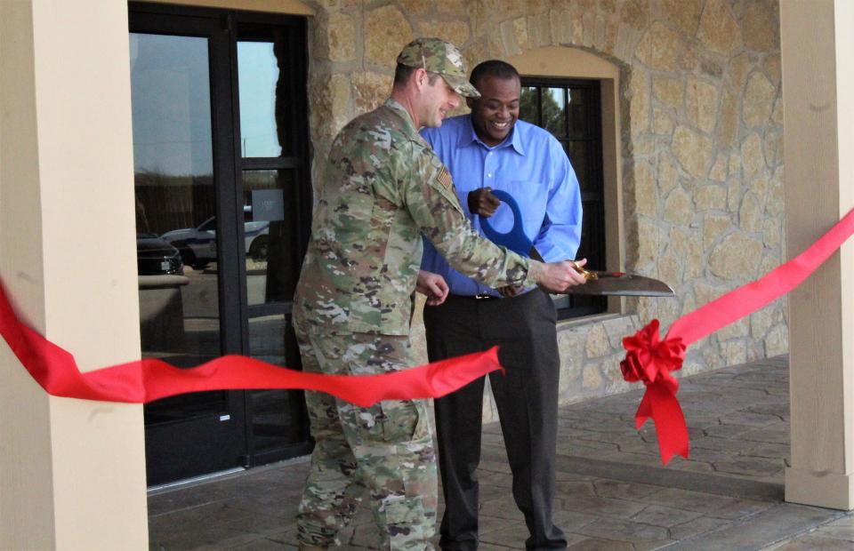 Col. Joseph Kramer and Abilene Mayor Anthony Williams in December 2021 cut the ribbon to the renovated Visitor Control Center at the main gate of Dyess AFB. Kramer on Monday relinquished command of the Air Force base after two years and a month; Williams in May ended 22 years in local city government.