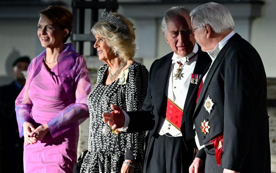 King Charles III and the Queen are welcomed by Frank-Walter Steinmeier, the German president, and his wife Elke Buedenbender - John MacDougall/AFP