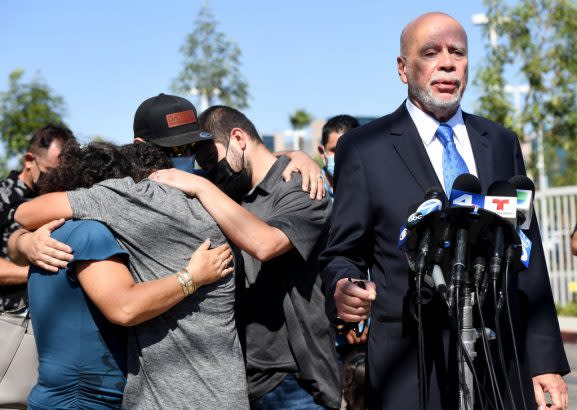 Attorney Luis Carrillo speaks to the media on behalf of the family of Mona Rodriguez, who was shot by a school safety officer near Millikan High School. (Brittany Murray / Getty Images)