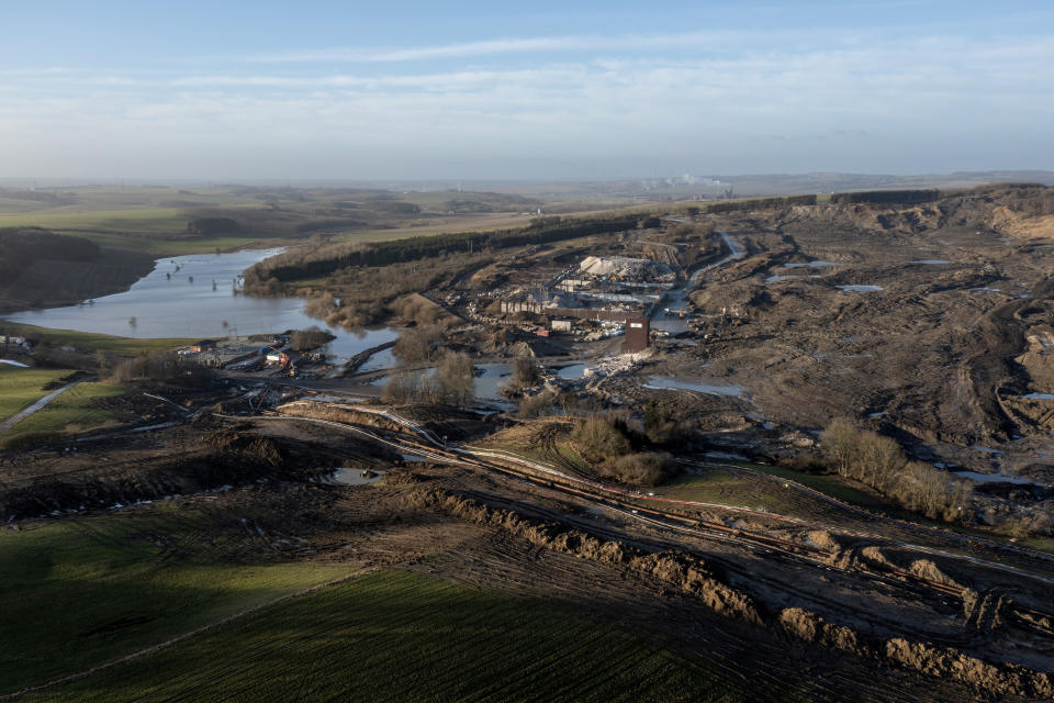 The area affected by a landslide of several million tonnes contaminated soil is pictured, near the village of Oelst, near Randers, Denmark, Thursday Jan. 25, 2024. On Monday, Prime Minister Mette Frederiksen said that "of course, it would be totally unfair if the children in Randers or elderly have to pay this bill,” after visiting the site with a 75-meter (82-yard) tall heap of dirt at the Nordic Waste reprocessing plant site with 3 million cubic meters (3,923,852 cubic yard) of contaminated soil. (Bo Amstrup/Ritzau Scanpix via AP)