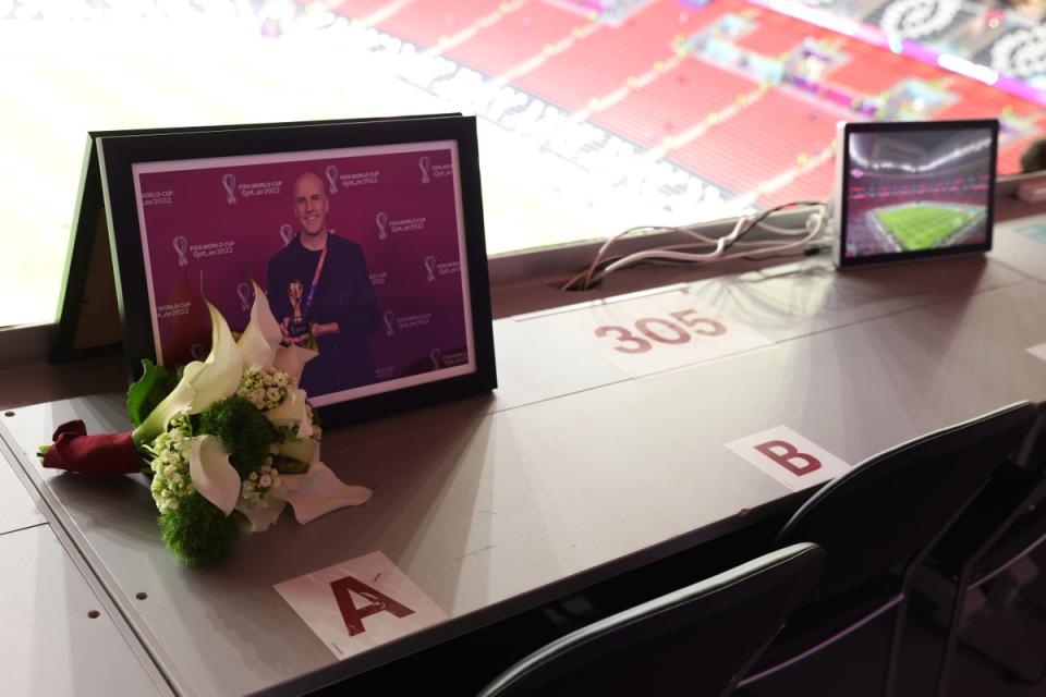 Flowers are placed in memory of Grant Wahl, an American sports journalist who passed away whilst reporting on the Argentina and Netherlands match (Getty Images)