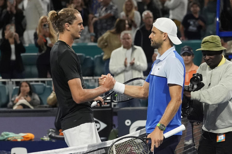 Alexander Zverev, left, of Germany, and Grigor Dimitrov, of Bulgaria, shake hands after Dimitrov won their semifinal at the Miami Open tennis tournament Friday, March 29, 2024, in Miami Gardens, Fla. (AP Photo/Marta Lavandier)