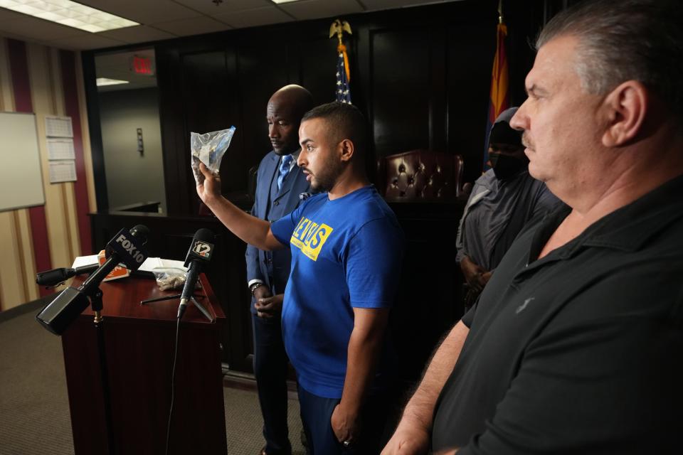 Loay Alyousfi, close family friend of Ali Osman, who was killed by Phoenix police, speaks to the press as their attorney and the family hold a news conference on Thursday, Sept. 29, 2022. 