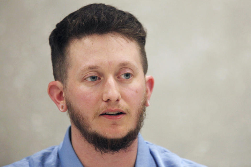 Riley Long, a special education teacher at Blue Valley West High School in Overland Park, Kan., speaks to reporters during a news conference, Monday, April 15, 2024, at the Johnson County Library branch in Lenexa, Kan. Long, who is transgender, opposes a proposed ban on gender-affirming care for minors and worries that one provision would hinder teachers in supporting children exploring their gender identities. (AP Photo/John Hanna)