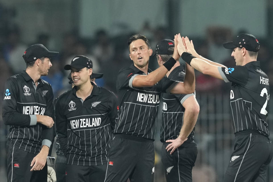 New Zealand's Trent Boult celebrates the dismissal of Afghanistan's Azmatullah Omarzai during the ICC Cricket World Cup match between Afghanistan and New Zealand in Chennai, India, Wednesday, Oct. 18, 2023. (AP Photo/Eranga Jayawardena)