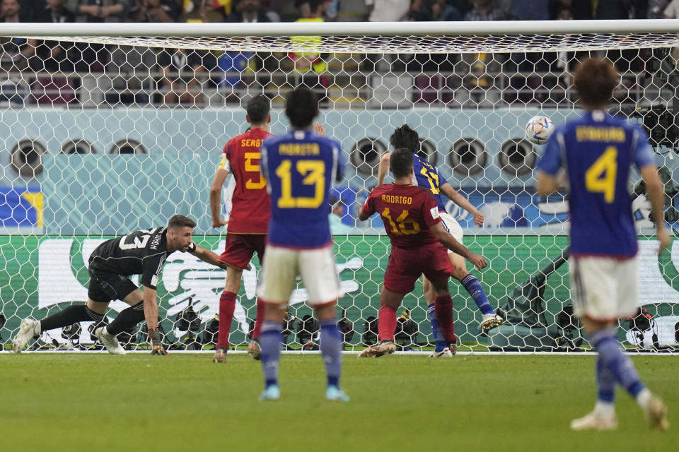 Japan's Ao Tanaka (17) scores their second goal during the World Cup group E soccer match between Japan and Spain, at the Khalifa International Stadium in Doha, Qatar, Thursday, Dec. 1, 2022. (AP Photo/Aijaz Rahi)