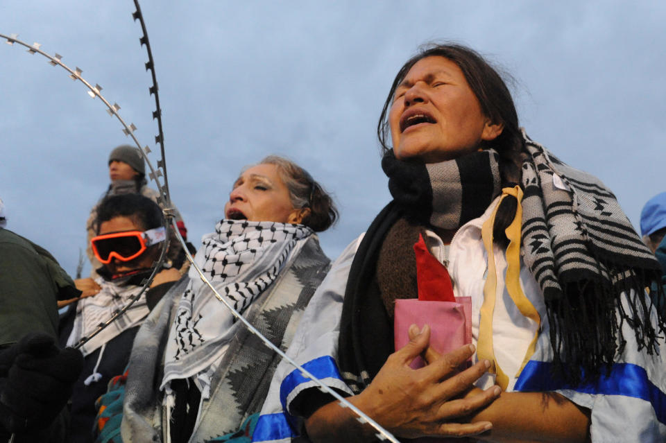 Women hold a prayer ceremony on Backwater Bridge during a protest against plans to pass the Dakota Access pipeline near the Standing Rock Indian Reservation, near Cannon Ball, North Dakota, U.S. November 27, 2016. REUTERS/Stephanie Keith