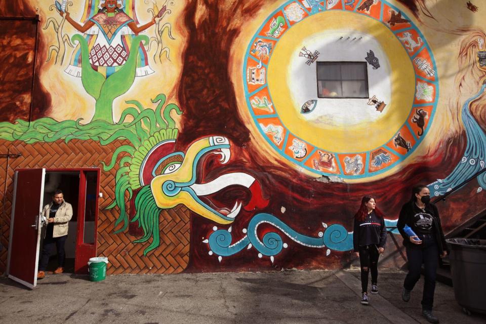 Minnie Ferguson, co-founder of the the Anahuacalmecac school, right, stands next to student Marye Chairez.