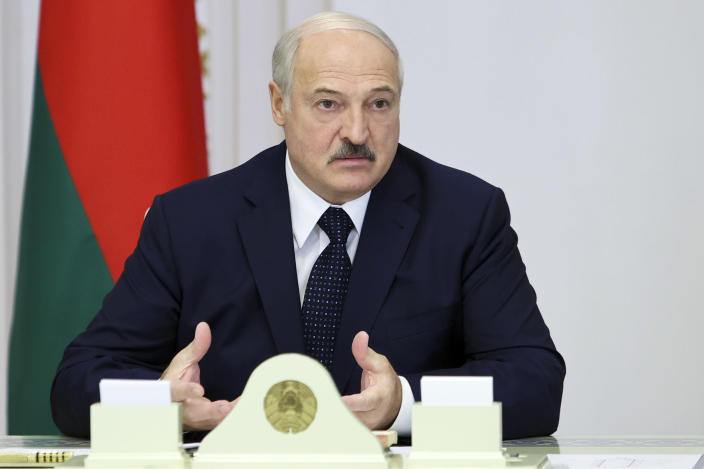 Belarusian President Alexander Lukashenko speaks during a meeting with officials in Minsk, Belarus, Thursday, Aug. 27, 2020. Russian President Vladimir Putin says that his Belarusian counterpart has asked him to provide security assistance to help stabilize the situation in the country if needed, adding that there is no such need yet. Belarus' authoritarian president, Alexander Lukashenko, is facing weeks of protests against his reelection in the Aug. 9 vote, which the opposition say was rigged. (Sergei Sheleg, BelTA Pool via AP)