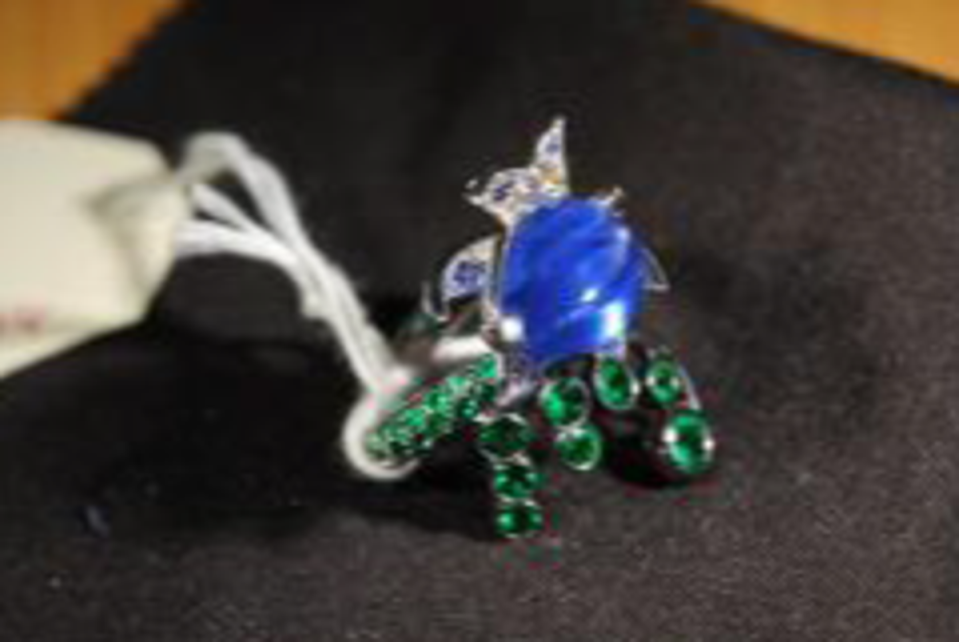 A Boucheron Sapphire and Emerald Ring that is part of the collection the NCA want to seize (NCA)