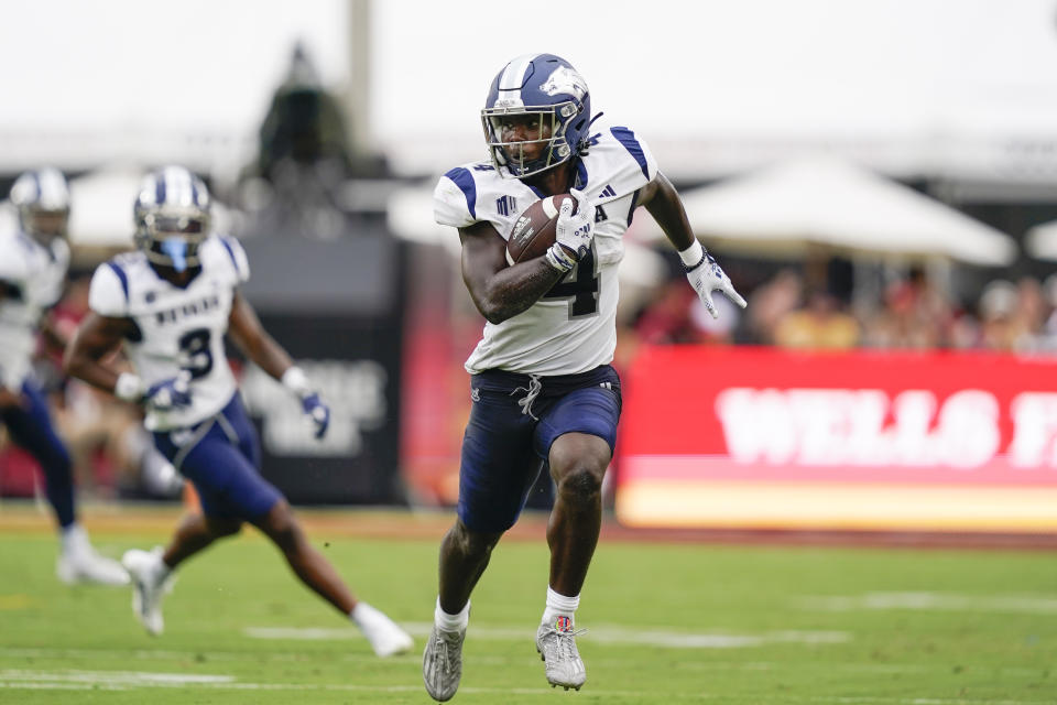 Nevada running back Sean Dollars runs the ball during the first half of an NCAA college football game against Southern California, Saturday, Sept. 2, 2023, in Los Angeles. (AP Photo/Ryan Sun)