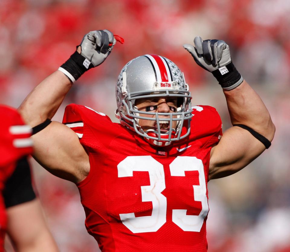 (OSUWIS Sauer 11/3/07) Ohio State's #33 James Laurinaitis (cq) tries to fire up the crowd in the second half of their game against Wisconsin at Ohio Stadium, Saturday, November 3, 2007, in Columbus, OH. (Dispatch photo by Renee Sauer)