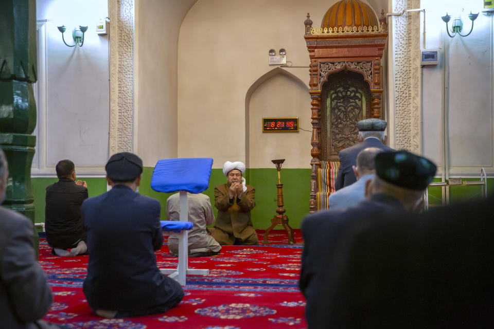 Uyghurs and other members of the faithful pray during services at the Id Kah Mosque in Kashgar in western China's Xinjiang Uyghur Autonomous Region, as seen during a government organized visit for foreign journalists on April 19, 2021. Under the weight of official policies, the future of Islam appears precarious in Xinjiang, a remote region facing Central Asia in China's northwest corner. Outside observers say scores of mosques have been demolished, which Beijing denies, and locals say the number of worshippers is on the decline. (AP Photo/Mark Schiefelbein)