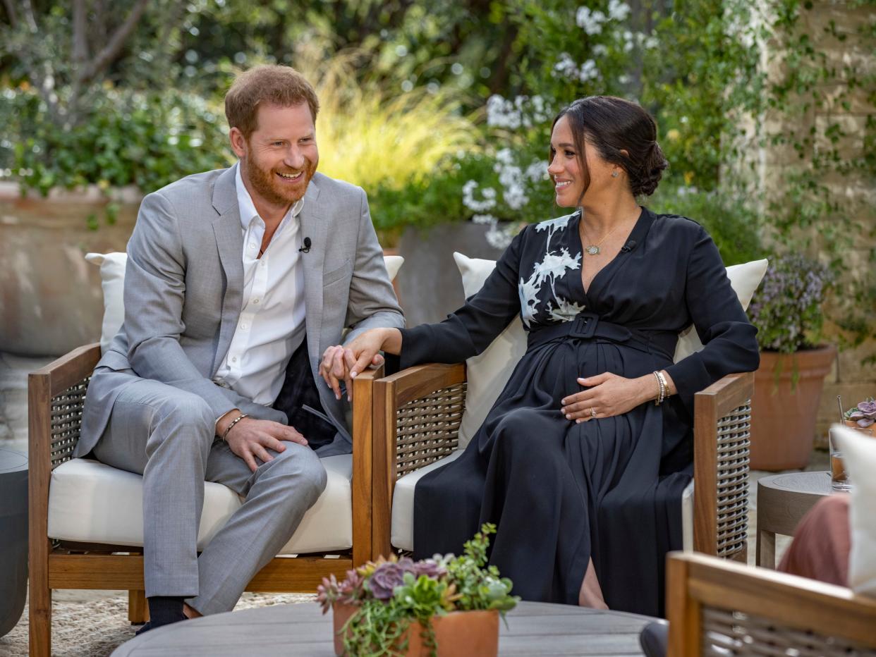 <p>This image provided by Harpo Productions shows Prince Harry, left, and Meghan, Duchess of Sussex, speaking about expecting their second child during an interview with Oprah Winfrey</p> (AP)