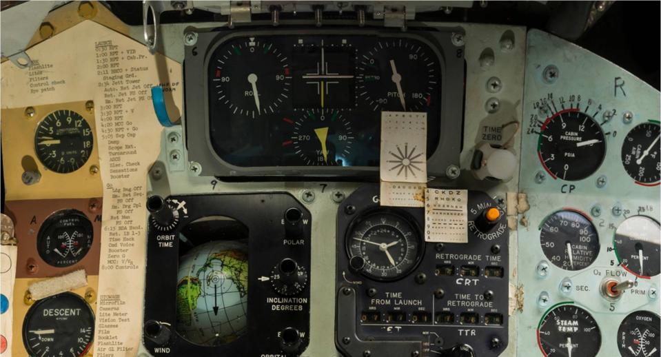 an eyechart taped to the control panel of a spacecraft