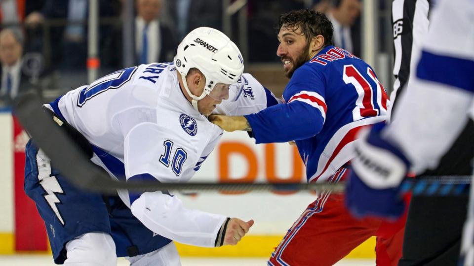 Apr 5, 2023; New York, New York, USA; Tampa Bay Lightning right wing Corey Perry (10) and New York Rangers center Vincent Trocheck (16) fight during the second period at Madison Square Garden.
