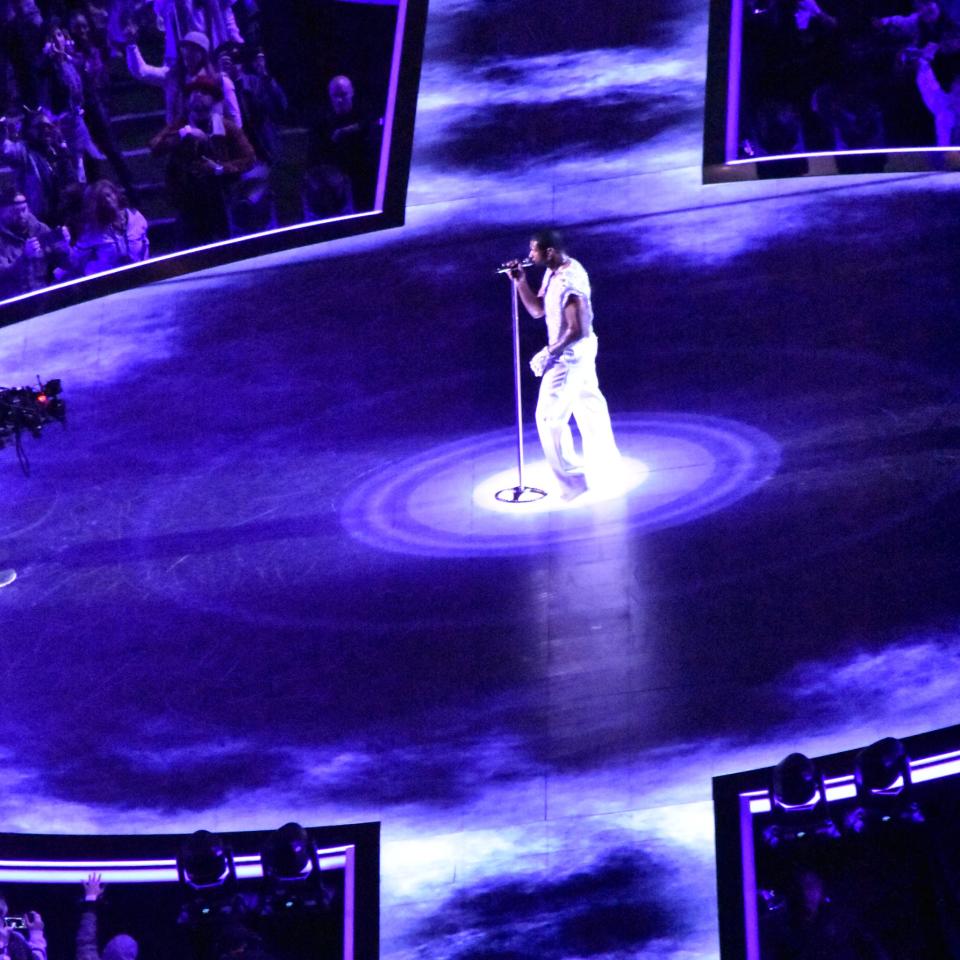 Usher performs on stage