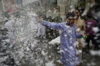 A boy sprays foam as he participates in a procession to mark Eid-e-Milad-ul-Nabi, or birthday celebrations of Prophet Mohammad in Mumbai January 14, 2014. REUTERS/Danish Siddiqui (INDIA - Tags: RELIGION SOCIETY)