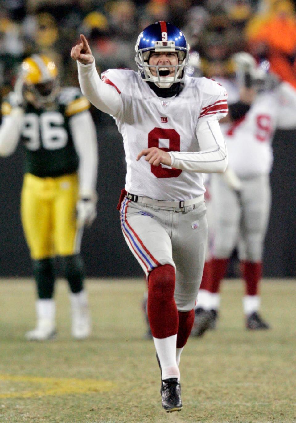 New York Giants kicker Lawrence Tynes sprints off the field after kicking the game-winning field goal in overtime to win the NFC Championship game against the Green Bay Packers Sunday, January 20, 2008 at Lambeau Field in Green Bay, Wis.