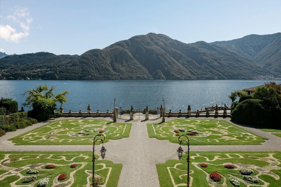 A lawn overlooking Lake Como and surrounding mountains.