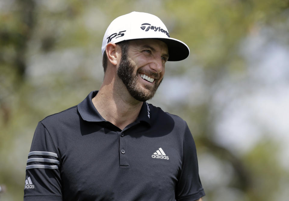 Dustin Johnson watches his shot from the first tee during round-robin play against Webb Simpson at the Dell Technologies Match Play golf tournament at Austin County Club, Wednesday, March 22, 2017, in Austin, Texas. (AP Photo/Eric Gay)