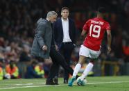 <p>Manchester United manager Jose Mourinho gives the ball to Marcus Rashford as Celta Vigo coach Eduardo Berizzo looks on </p>