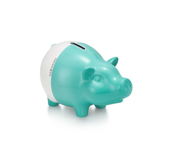 A white and green piggy bank.