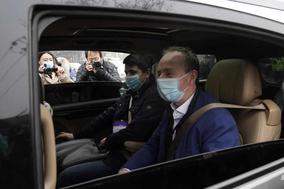Members of a World Health Organization team arrive at the Hubei Center for Disease Control and Prevention in Wuhan in central China's Hubei province Monday, Feb. 1, 2021. The WHO mission team investigating the origins of the coronavirus pandemic in Wuhan. (AP Photo/Ng Han Guan)