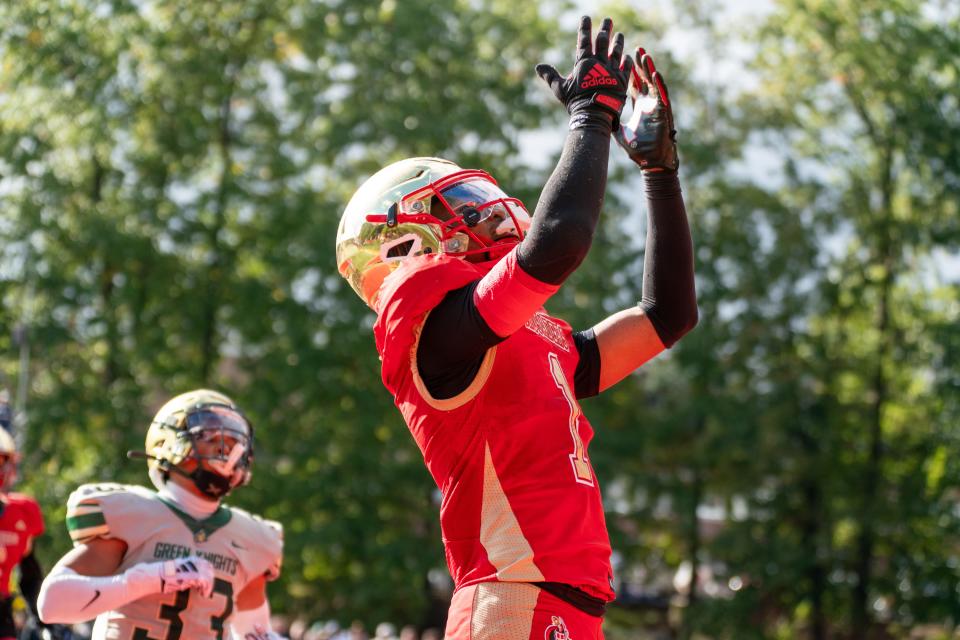 Kaj Sanders (1) of Bergen Catholic gestures to the air after scoring a touchdown during the 4th quarter of a football game between Bergen Catholic High School and St. Joseph Regional High School at Bergen Catholic High School in Oradell on Sunday, October 15, 2023.