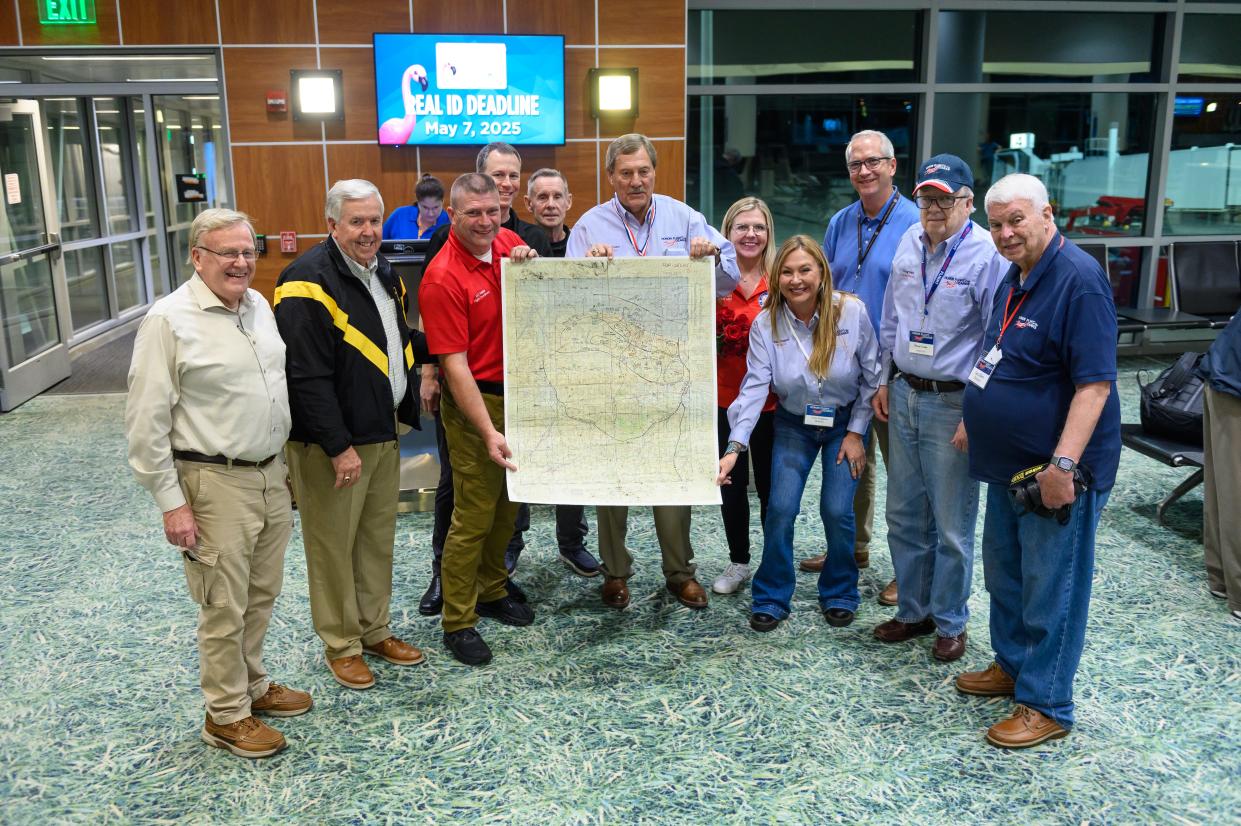 Missouri Gov. Mike Parson (second from left) presents a "Top Secret" map of the Omaha Beach D-Day landing area to Honor Flight of the Ozarks representatives Oct. 25. The World War II map will be auctioned at an Honor Flight fundraiser in October 2024.