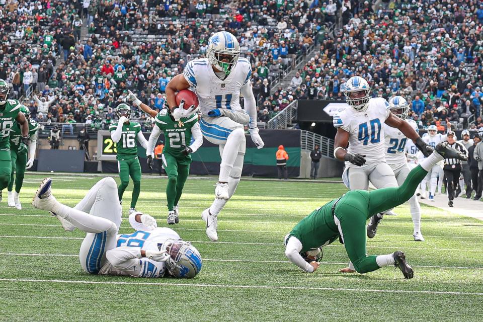 Detroit Lions wide receiver Kalif Raymond returns a punt for touchdown against the New York Jets during the first quarter at MetLife Stadium, Dec. 18, 2022 in East Rutherford, N.J.