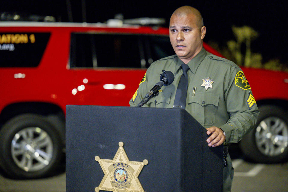 Sgt. Frank Gonzalez, spokesman for the Orange County Sheriff's Office, speaks briefly to reporters Wednesday night, Aug. 23, 2023, in Lake Forest, Calif., after the shooting at Cook's Corner, a biker bar in Trabuco Canyon. (Leonard Ortiz/The Orange County Register via AP)